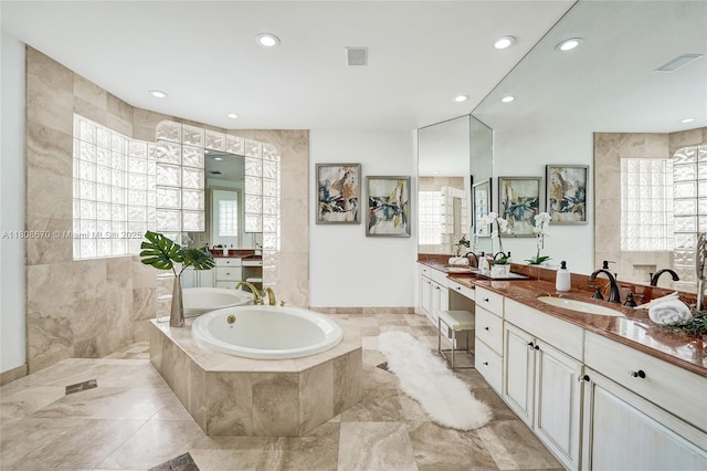 169 Dockside Cir, Weston, FL 33327 - bathroom with a garden tub, two vanities, recessed lighting, and baseboards