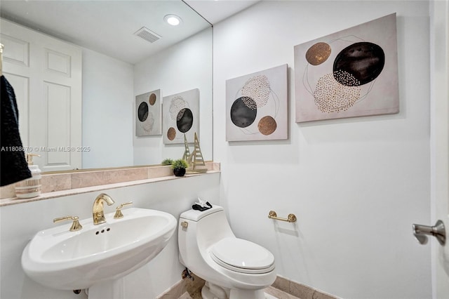 169 Dockside Cir, Weston, FL 33327 - half bathroom with a sink, toilet, and baseboards