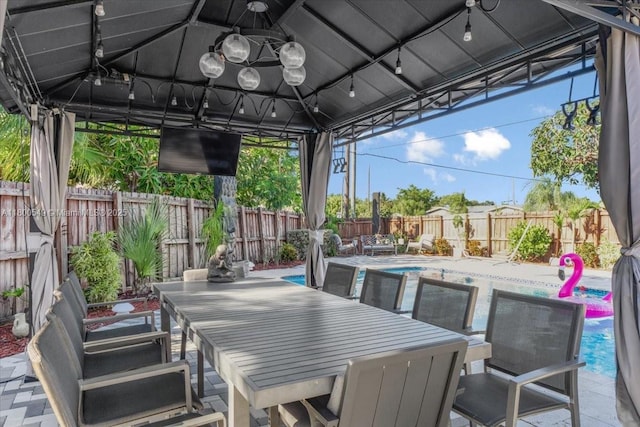 4340 NW 19th Ave, Oakland Park, FL 33309 - fenced backyard featuring a gazebo and outdoor dining space
