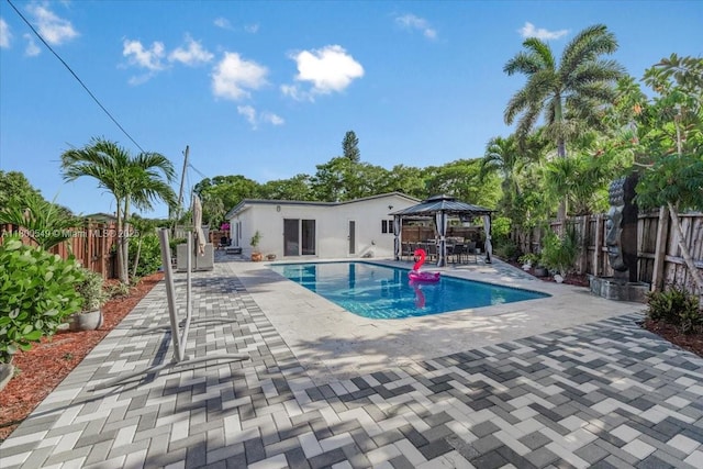 4340 NW 19th Ave, Oakland Park, FL 33309 - view of swimming pool featuring a gazebo, a patio area, and a fenced backyard