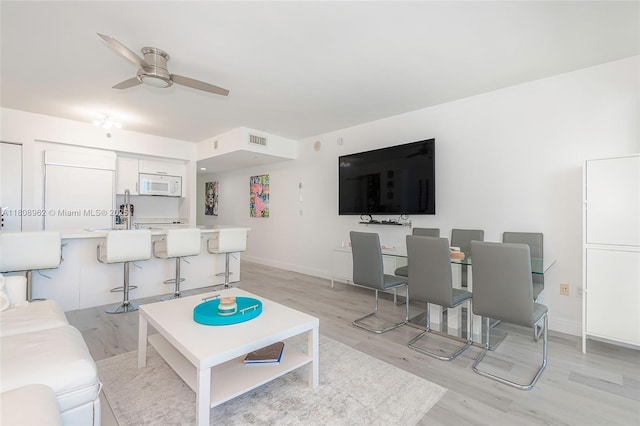 1830 S Ocean Dr Unit 1605, Hallandale Beach, FL 33009 - living room with light wood-style floors, ceiling fan, and baseboards