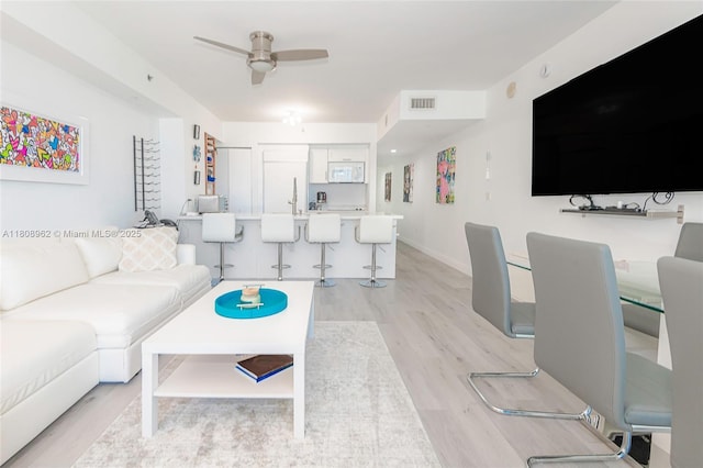 1830 S Ocean Dr Unit 1605, Hallandale Beach, FL 33009 - living room with light wood-type flooring, ceiling fan, and baseboards