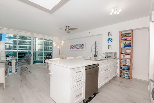 1830 S Ocean Dr Unit 1605, Hallandale Beach, FL 33009 - kitchen with dishwasher, a sink, light wood-type flooring, and white cabinets