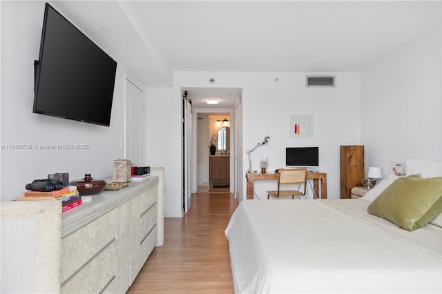 2101 Brickell Ave Unit 1702, Miami, FL 33129 - bedroom featuring light wood-type flooring
