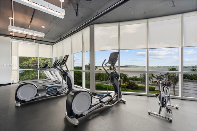 2101 Brickell Ave Unit 1702, Miami, FL 33129 - exercise room featuring plenty of natural light, a water view, and floor to ceiling windows