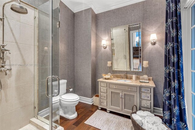 7360 SW 164th St, Palmetto Bay, FL 33157 - full bathroom featuring ornamental molding, wood finished floors, a stall shower, vanity, and toilet