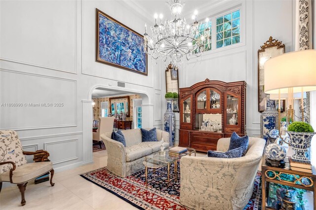 7360 SW 164th St, Palmetto Bay, FL 33157 - living room featuring a decorative wall, a high ceiling, arched walkways, a chandelier, and healthy amount of natural light