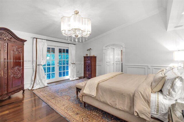 7360 SW 164th St, Palmetto Bay, FL 33157 - bedroom featuring french doors, ornamental molding, a decorative wall, wood finished floors, and a chandelier
