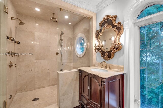 7360 SW 164th St, Palmetto Bay, FL 33157 - bathroom with a tile shower, ornamental molding, and vanity