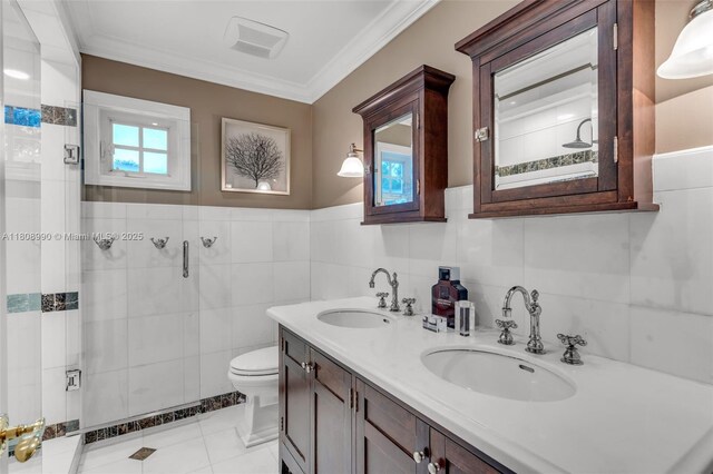 7360 SW 164th St, Palmetto Bay, FL 33157 - bathroom with tile walls, a stall shower, toilet, double vanity, and ornamental molding