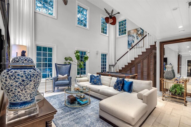 7360 SW 164th St, Palmetto Bay, FL 33157 - living room featuring stairs, recessed lighting, a towering ceiling, and stone tile flooring