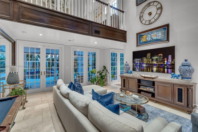 7360 SW 164th St, Palmetto Bay, FL 33157 - living area featuring french doors, recessed lighting, a high ceiling, and stone tile flooring