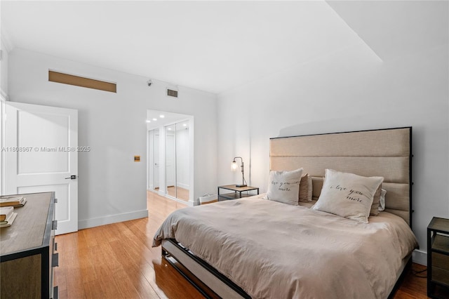 201 Crandon Blvd Unit 1030, Key Biscayne, FL 33149 - bedroom featuring light wood-type flooring, baseboards, and crown molding