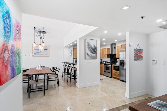 201 Crandon Blvd Unit 1030, Key Biscayne, FL 33149 - kitchen with wall chimney range hood, appliances with stainless steel finishes, baseboards, recessed lighting, and decorative backsplash