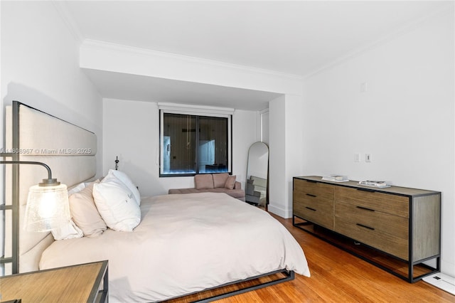 201 Crandon Blvd Unit 1030, Key Biscayne, FL 33149 - bedroom featuring ornamental molding and light wood-style flooring