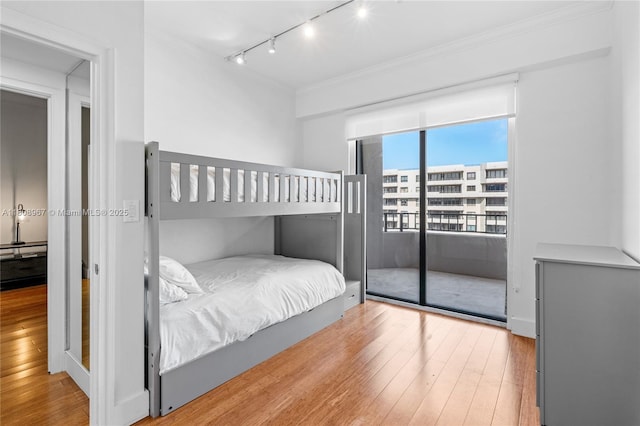 201 Crandon Blvd Unit 1030, Key Biscayne, FL 33149 - bedroom with track lighting, hardwood / wood-style floors, and crown molding