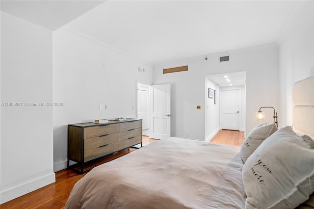 201 Crandon Blvd Unit 1030, Key Biscayne, FL 33149 - bedroom with wood finished floors, crown molding, and baseboards