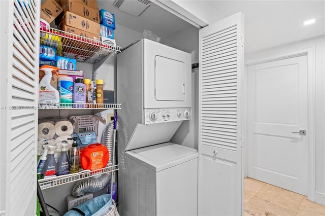 201 Crandon Blvd Unit 1030, Key Biscayne, FL 33149 - washroom featuring stacked washer / dryer and tile patterned flooring
