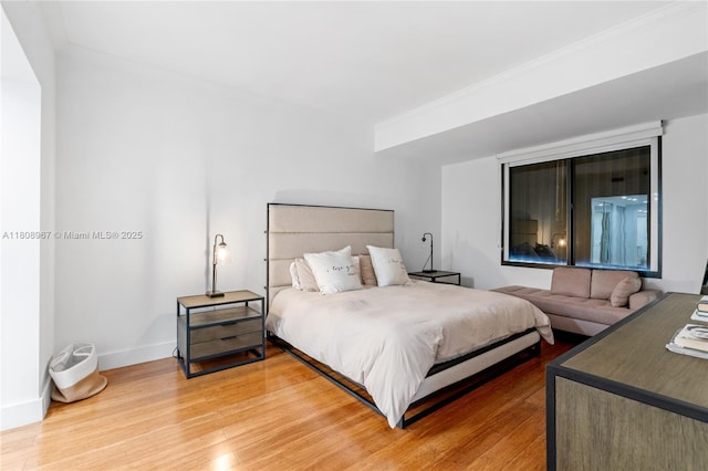 201 Crandon Blvd Unit 1030, Key Biscayne, FL 33149 - bedroom featuring light wood-style flooring, crown molding, and baseboards