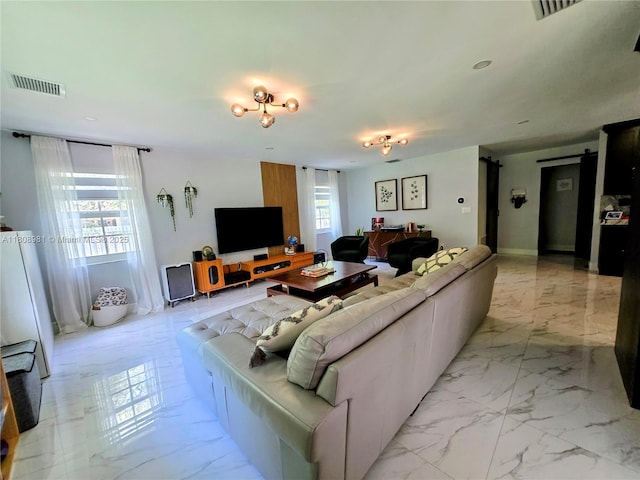 14870 SW 152nd Ct, Miami, FL 33196 - living room with light marble finish flooring and a barn door