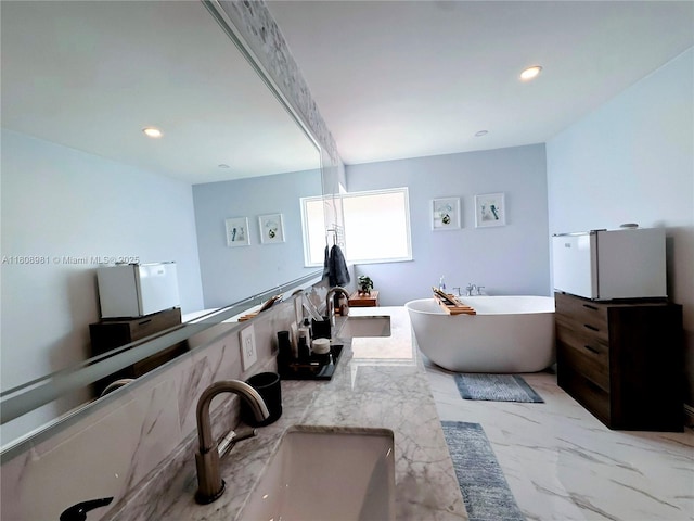 14870 SW 152nd Ct, Miami, FL 33196 - bathroom with a freestanding bath, double vanity, marble look tiles, and recessed lighting