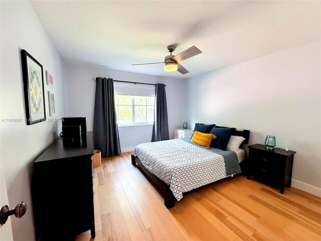 14870 SW 152nd Ct, Miami, FL 33196 - bedroom featuring light wood finished floors, baseboards, and a ceiling fan