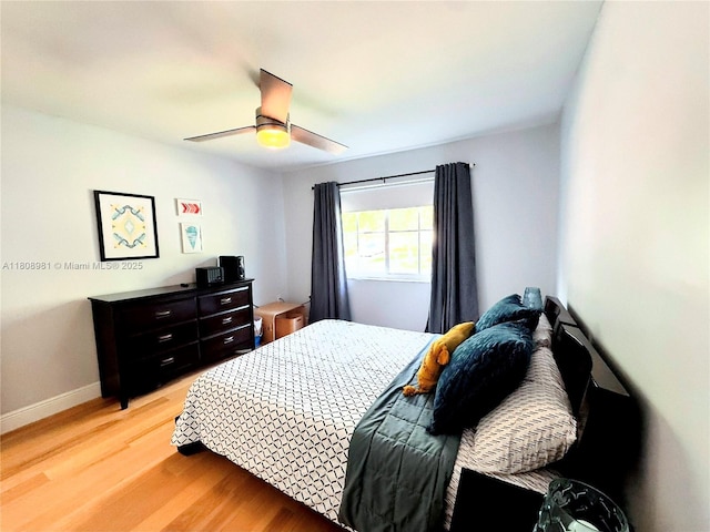 14870 SW 152nd Ct, Miami, FL 33196 - bedroom with light wood-style floors, a ceiling fan, and baseboards