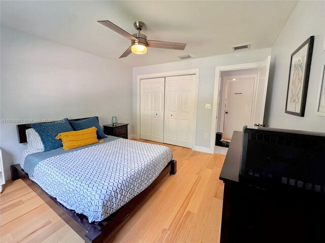 14870 SW 152nd Ct, Miami, FL 33196 - bedroom with a closet, light wood-style flooring, baseboards, and ceiling fan