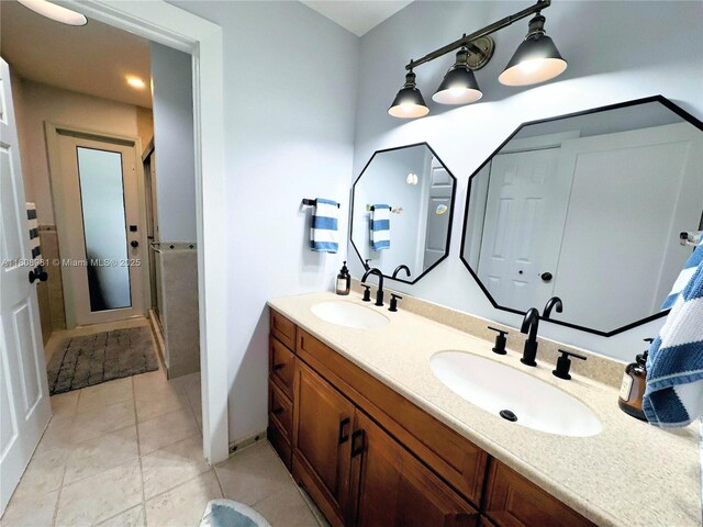 14870 SW 152nd Ct, Miami, FL 33196 - full bathroom with double vanity, tile patterned flooring, and a stall shower