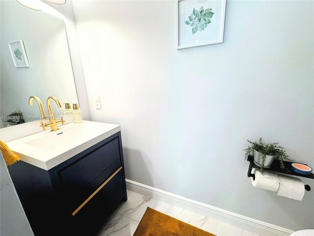 14870 SW 152nd Ct, Miami, FL 33196 - bathroom with marble look tiles, vanity, and baseboards