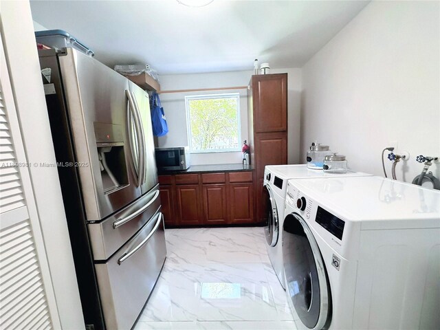 14870 SW 152nd Ct, Miami, FL 33196 - laundry room featuring cabinet space, separate washer and dryer, and light marble finish floors