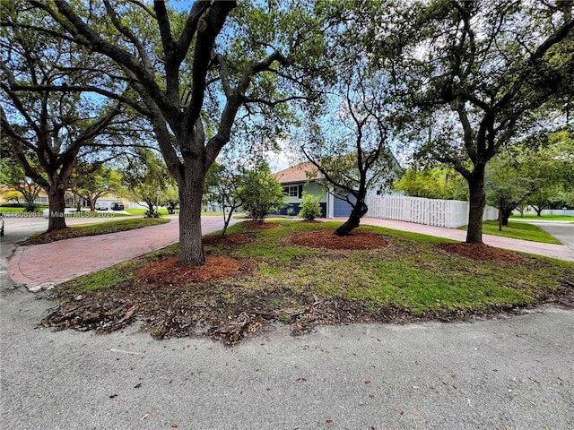 14870 SW 152nd Ct, Miami, FL 33196 - view of property hidden behind natural elements featuring curved driveway