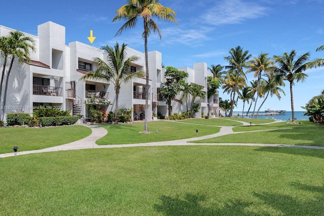 601 W Ocean Dr Dr Unit 411C, Key Colony, FL 33051 - surrounding community featuring a water view and a yard