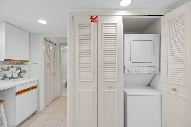 601 W Ocean Dr Dr Unit 411C, Key Colony, FL 33051 - laundry area with stacked washing machine and dryer and light tile patterned floors