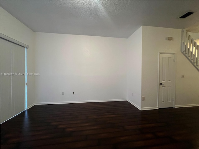 20820 San Simeon Way Unit 24-G, Miami, FL 33179 - additional living space with wood finished floors, baseboards, and a textured ceiling