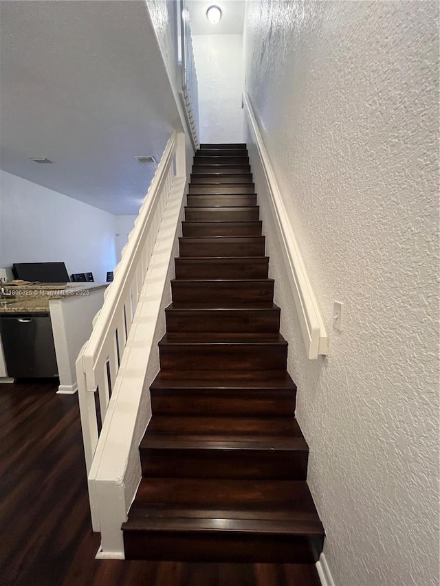 20820 San Simeon Way Unit 24-G, Miami, FL 33179 - staircase with a textured wall, wood finished floors, and baseboards