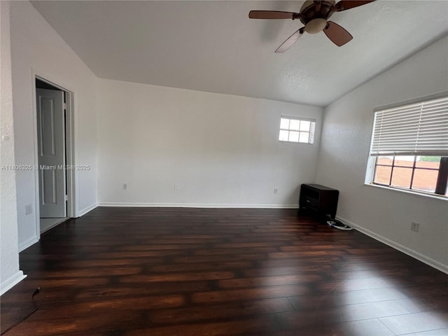 20820 San Simeon Way Unit 24-G, Miami, FL 33179 - spare room with lofted ceiling, ceiling fan, dark wood-type flooring, and baseboards