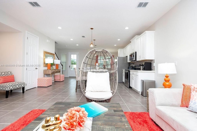 1515 Carey Palm Cir, Kissimmee, FL 34747 - living room featuring light tile patterned floors and recessed lighting
