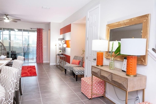 1515 Carey Palm Cir, Kissimmee, FL 34747 - tiled living room with a ceiling fan and baseboards
