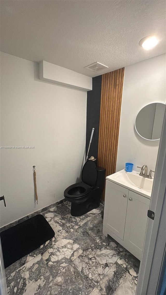 13416 SW 287th St Unit A, Homestead, FL 33033 - bathroom with vanity, a textured ceiling, and toilet