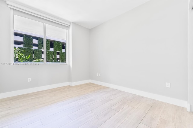 16385 Biscayne Blvd Unit 404, North Miami Beach, FL 33160 - empty room with wood finished floors and baseboards