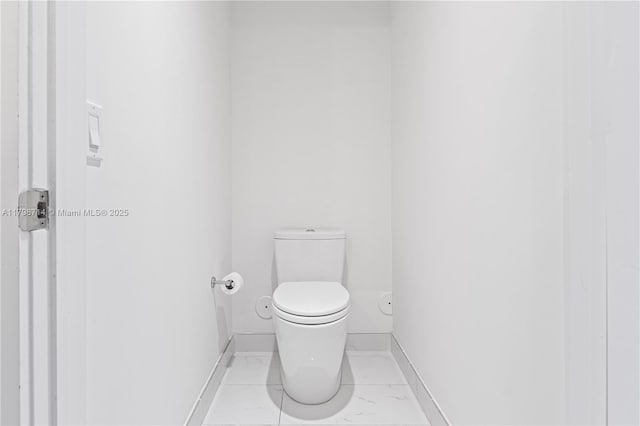 16385 Biscayne Blvd Unit 404, North Miami Beach, FL 33160 - bathroom featuring toilet and baseboards