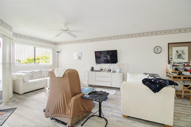 1400 SW 137th Ave Unit 311F, Pembroke Pines, FL 33027 - living area with a textured ceiling, a ceiling fan, and light wood finished floors