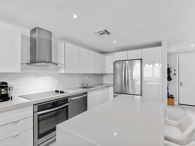 1600 NE 1st Ave Unit 3311, Miami, FL 33132 - kitchen featuring appliances with stainless steel finishes, wall chimney exhaust hood, modern cabinets, a sink, and recessed lighting