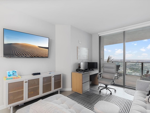 1600 NE 1st Ave Unit 3311, Miami, FL 33132 - bedroom with expansive windows, access to outside, a desk, and baseboards