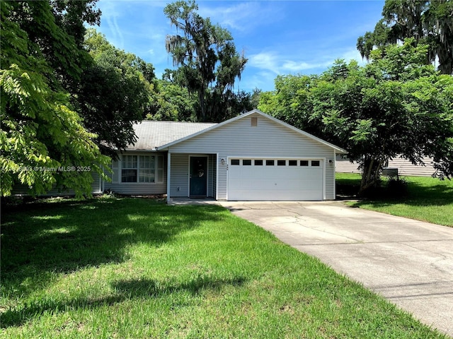 325 E Plymouth, Deland, FL 32724 - ranch-style home with an attached garage, a front yard, and driveway