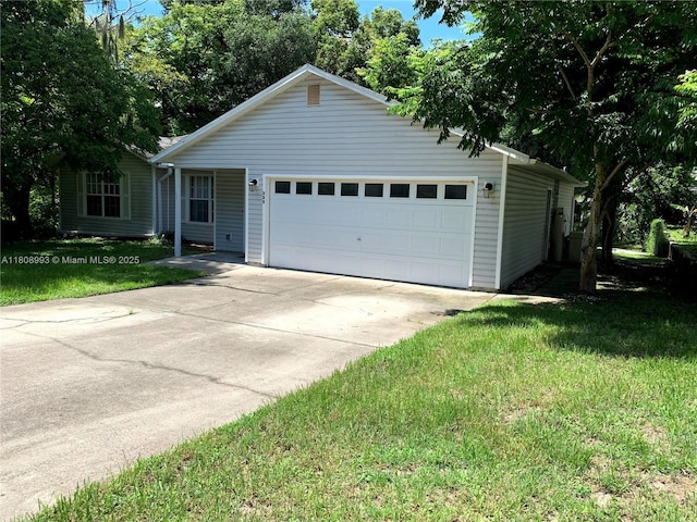 325 E Plymouth, Deland, FL 32724 - ranch-style house with a detached garage and a front yard