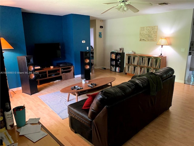 325 E Plymouth, Deland, FL 32724 - living area featuring wood finished floors, ceiling fan, and baseboards
