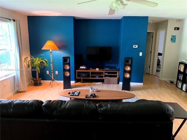 325 E Plymouth, Deland, FL 32724 - living area with wood finished floors, a ceiling fan, and baseboards