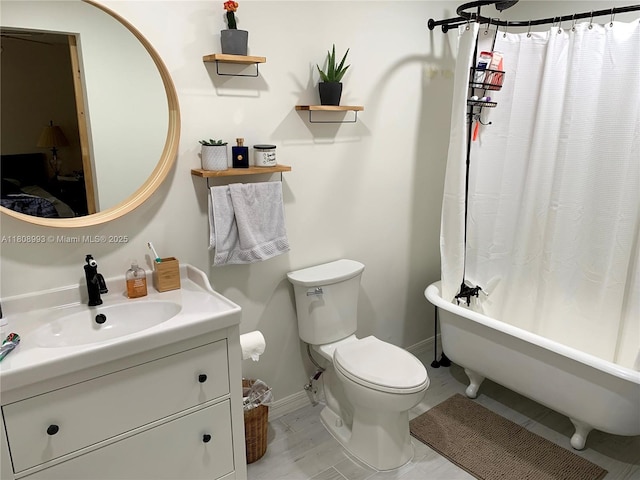 325 E Plymouth, Deland, FL 32724 - bathroom with vanity, toilet, and baseboards